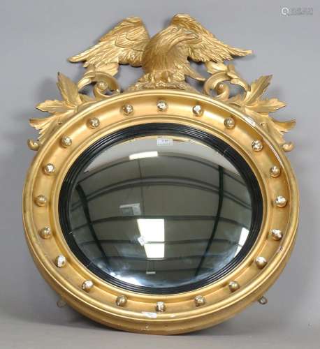 A late 19th century Regency style giltwood and gesso circula...