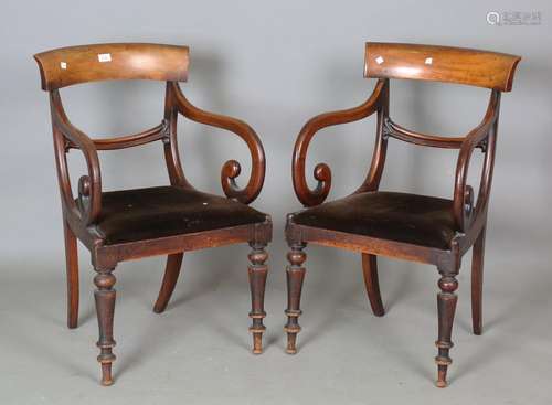 A pair of early Victorian mahogany bar back elbow chairs wit...