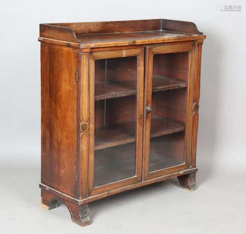 A Regency mahogany and brass inlaid side cabinet