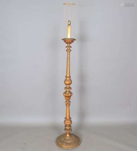A 20th century giltwood lamp standard with carved foliate de...