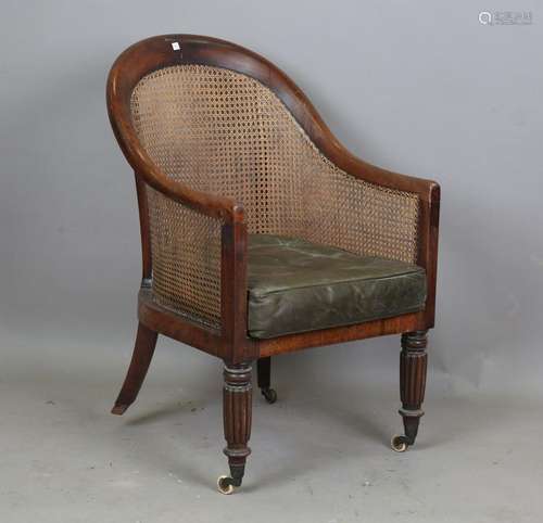 A William IV mahogany tub back bergère library armchair