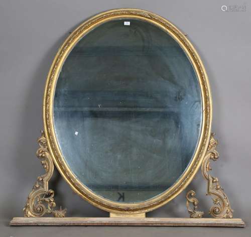 A large Victorian giltwood and gesso oval overmantel mirror
