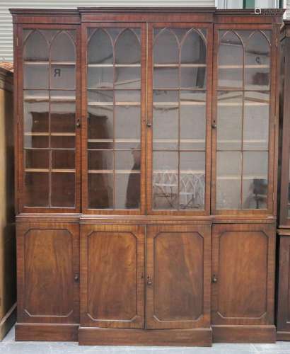 A mid-19th century mahogany breakfront library bookcase cabi...