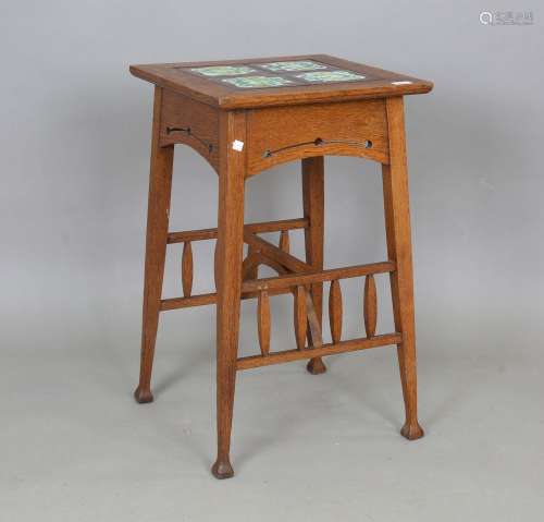 An Edwardian Arts and Crafts oak occasional table, probably ...