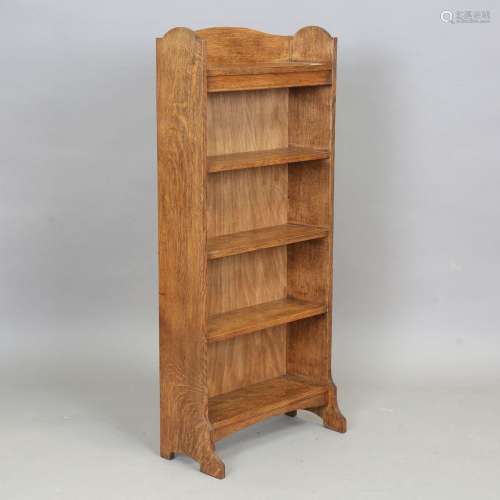 An early 20th century Arts and Crafts style oak open bookcas...