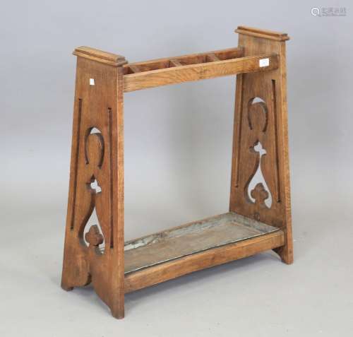 An Edwardian Arts and Crafts oak umbrella stand with pierced...