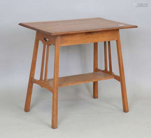 An Edwardian Arts and Crafts oak rectangular occasional tabl...