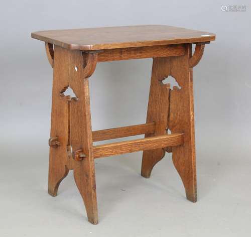An Edwardian Arts and Crafts oak canted rectangular occasion...