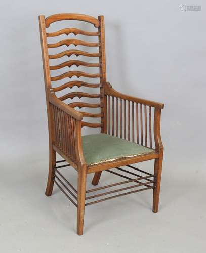 An Edwardian Arts and Crafts mahogany ladder back armchair, ...