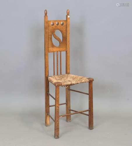 An early 20th century Arts and Crafts oak side chair, the pi...