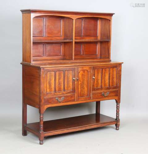 A late Victorian Arts and Crafts walnut dresser, the squat s...