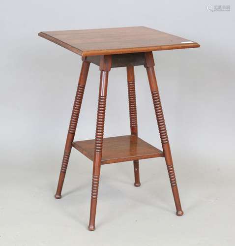 A late Victorian Aesthetic Movement walnut occasional table,...