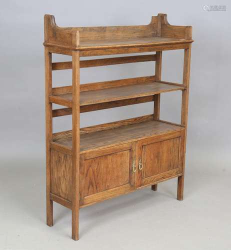 An Edwardian Arts and Crafts oak bookcase by Wylie & Loc...