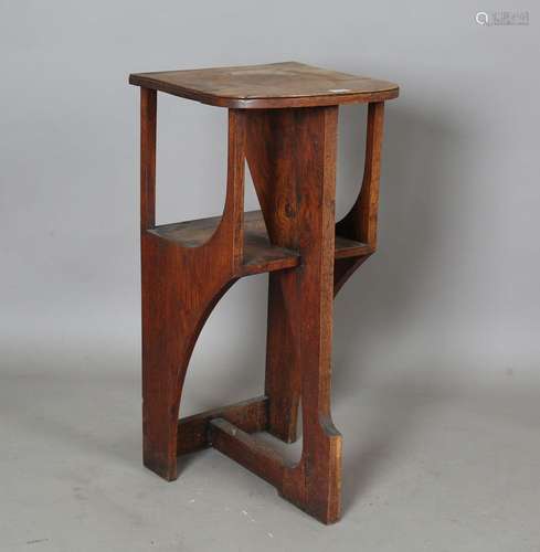 An early 20th century Arts and Crafts oak book table, in the...