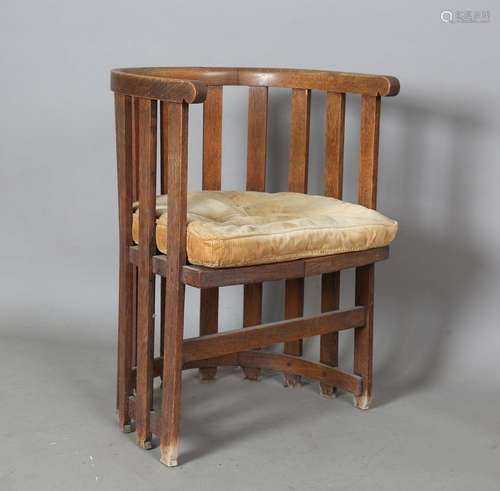 An early 20th century Arts and Crafts oak framed slatted tub...