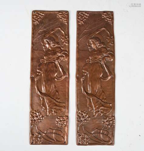 A pair of Glasgow School copper door plates, each decorated ...