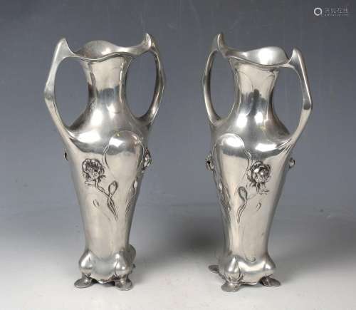 A pair of Art Nouveau cast pewter vases, possibly by WMF, th...