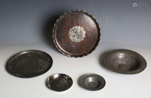 An Arts and Crafts hammered copper and pewter overlaid circu...