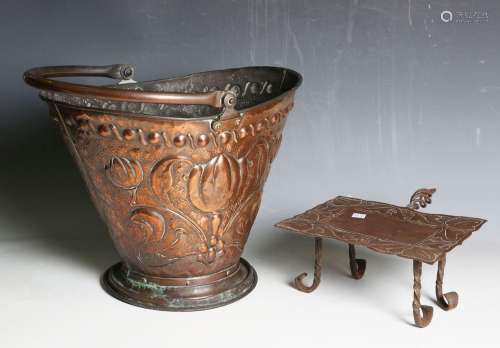 An Arts and Crafts copper coal bucket, repoussé decorated wi...