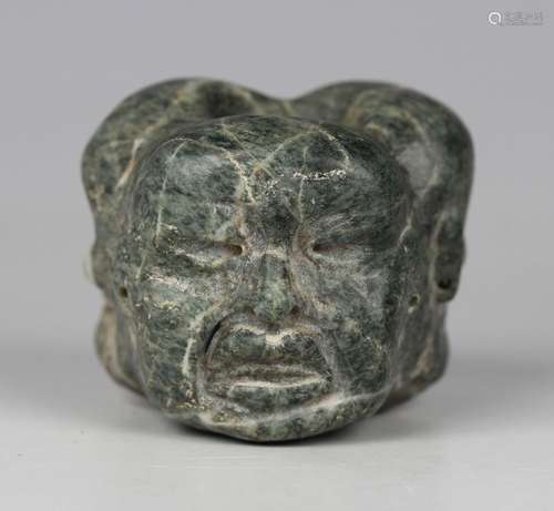 A pre-Columbian Olmec style carved green hardstone bead, pos...