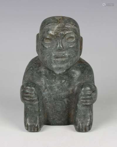 A pre-Columbian Olmec style carved green hardstone figure of...