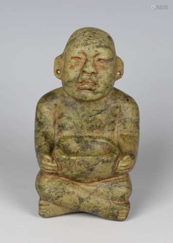 A pre-Columbian Olmec style carved green hardstone figure of...