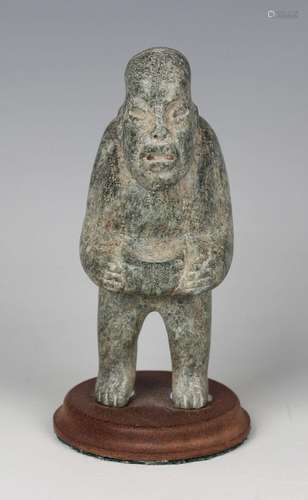 A pre-Columbian Olmec style carved green hardstone starcatch...