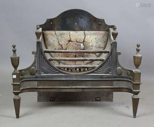 An early 20th century George III style brass and steel fire ...