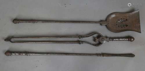 A set of three George III steel fire tools, each with a face...