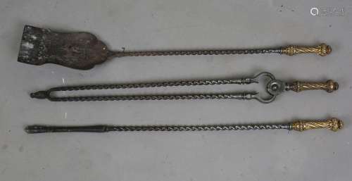 A set of three George III steel fire tools, each with a foli...