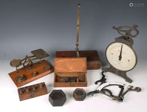 A collection of 19th and 20th century postal scales, hanging...