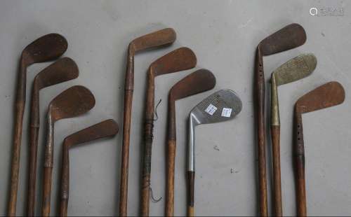 A group of ten hickory-shafted golf clubs, including an F. B...