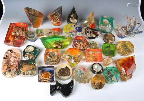 A mixed group of late 20th century perspex paperweights of v...