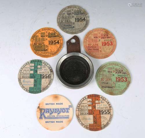 A mid-20th century automobile tax disc holder and six paper ...