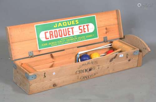 A late 20th century Jaques croquet set, within its pine box,...