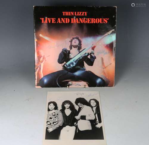 An LP record by Thin Lizzy, 'Live and Dangerous', signed to ...