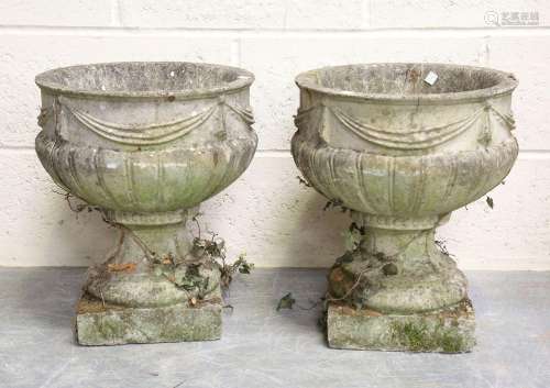 A pair of 20th century cast composition stone garden urns, t...