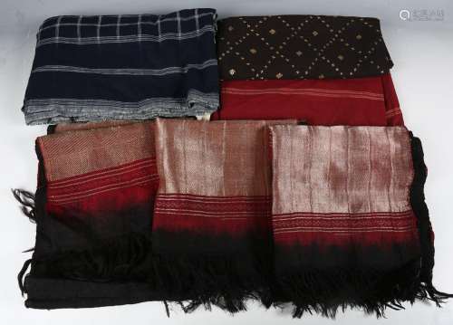 An early 20th century hand-woven Ikat shawl, the black groun...