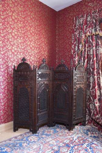 AN INDIAN CARVED HARDWOOD FOLDING ROOM SCREEN, LATE 19TH CEN...
