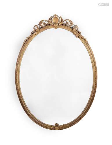 A LARGE CARVED GILTWOOD OVAL MIRROR, 19TH CENTURY