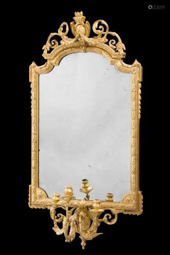 A CARVED GILTWOOD AND COMPOSITION GIRANDOLE MIRROR, FIRST QU...