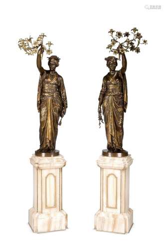 A RARE PAIR OF PARCEL GILT AND BRONZE FIGURAL TORCHERES, BY ...