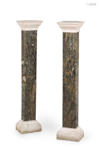 A PAIR OF WHITE AND VARIEGATED GREY STONE PEDESTAL COLUMNS, ...