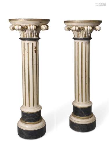 A PAIR OF ITALIAN CREAM PAINTED AND PARCEL GILT COLUMNS, IN ...