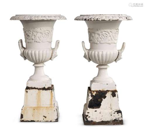 A PAIR OF CAST-IRON CAMPANA URNS AND STANDS, IN THE MANNER O...