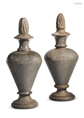 A PAIR OF TURNED AND CARVED GRANITE FINIALS, LATE 19TH CENTU...