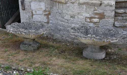 TWO SIMILAR COMPOSITION STONE PEDESTAL SHALLOW URNS, LATE 20...