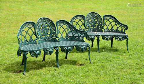 A PAIR OF GREEN PAINTED CAST ALUMINIUM GARDEN BENCHES, IN TH...
