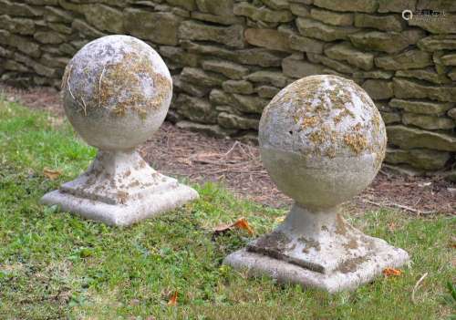 A PAIR OF STONE COMPOSITION BALL FINIALS, EARLY 20TH CENTURY