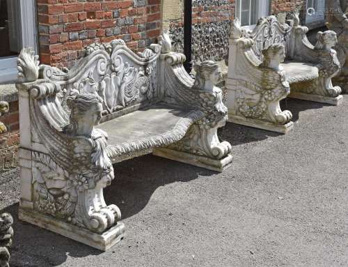 A PAIR OF CARVED WHITE MARBLE GARDEN BENCHES, IN RENAISSANCE...
